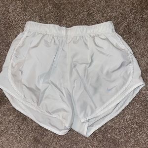 White Nike running shorts